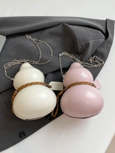 Unique gourd-shaped crossbody bags in cream and pink with woven details and metal chains