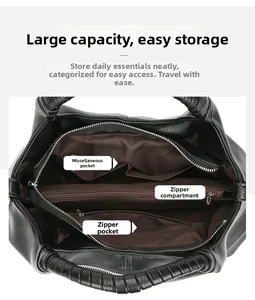 Internal view of the black leather tote bag with functional compartments and lining