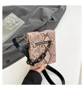 Pink snake print rectangular handbag with bold black chain and metal zipper detail
