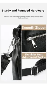 Detail view of black lychee grain leather handbag showing silver hooks and smooth zippers