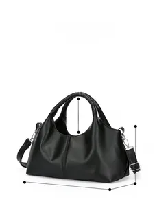 Detailed view showing dimensions of black pebble grain handbag with woven handles
