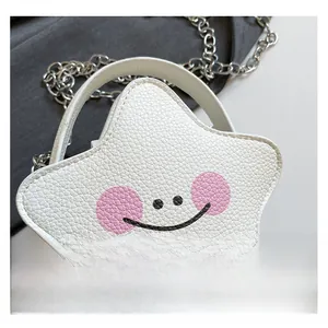 Macro detail of white star-shaped bag showing textured lychee leather and silver metal chain