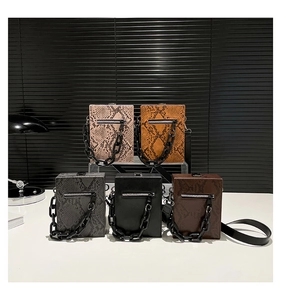 Detail view of stylish square crossbody bags in five colors with thick acrylic chains