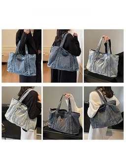 Macro shot of washed denim tote bag showing vintage textures and spacious pocket detail