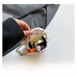 Detail view of mini white leather bag interior showing space for lipstick and cushion