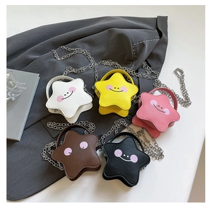 Detailed view of five colorful star-shaped mini bags with smiling faces and chain straps