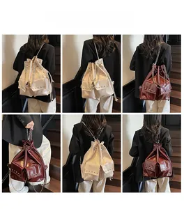 Detailed views of waterproof drawstring backpack with rivets and chain straps in two colors