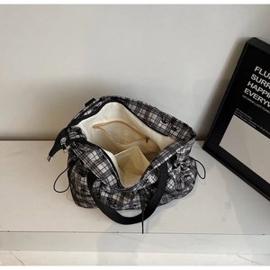 Interior view showing zippered pocket and lining of the floral pattern tote bag