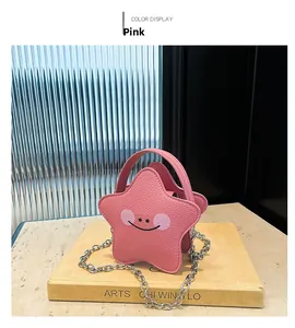 Detail of pink star-shaped girl's bag with cartoon smiley face and silver chain strap