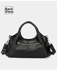 Detail view of the black retro handbag back side showing leather texture and zipper pocket