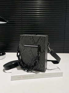 Chic grey python texture crossbody bag with black chain strap and top handle style