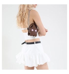 Star-shaped brown leather crossbody bag with cartoon smiley face and chain strap detail