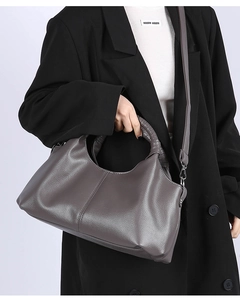 Macro detail of dark grey hobo bag with spiral leather handle and silver metal hooks