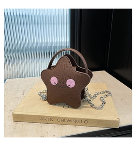 Detailed macro view of coffee-colored star-shaped bag with pink blush smiley face