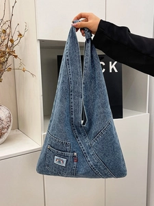 Minimalist light blue washed denim tote bag with rainbow label for daily commute
