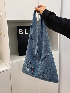 Retro washed denim hobo bag for women featuring functional pocket and wide shoulder strap