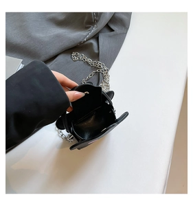 Interior view of mini crossbody star bag with silver chain strap and single compartment