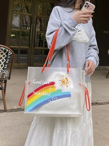 Fashionable transparent rainbow beach tote bag with orange handles and inner pouch