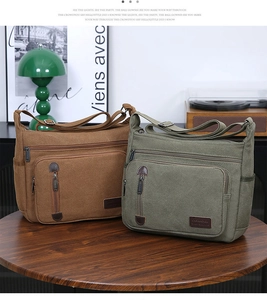 Detail view of retro canvas shoulder bags in coffee and army green with leather accents
