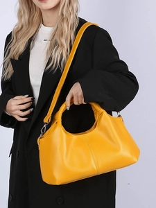 Vintage large yellow faux leather handbag with litchi grain texture and ring handles