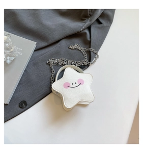Close-up of white star-shaped mini crossbody bag with cartoon face and silver chain