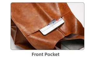 Detail view of the functional front pocket on a brown leather tote bag with tablet