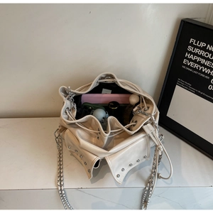 Top view of large capacity cream bucket bag interior showing tablet and cosmetics storage