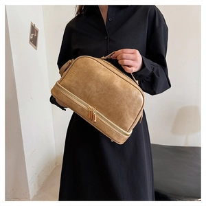 Detail of large capacity camel PU leather makeup bag with double zippers and top handle