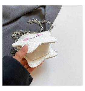 Star-shaped mini crossbody bag interior view showing storage space and pink smiley face