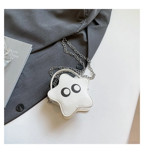 Detail of white star-shaped mini bag with lychee texture and metallic chain strap