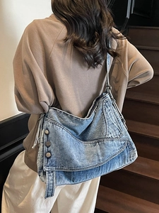 Retro washed denim tote bag with multiple pockets and adjustable shoulder strap for daily use