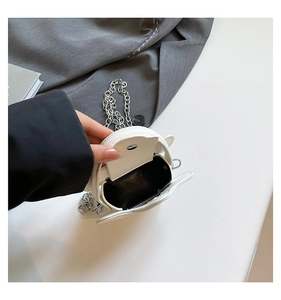 Detail view of mini star bag interior with magnetic snap closure and silver chain strap