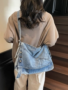 Retro light blue denim shoulder bag with fringe strap and silver metal buttons for women