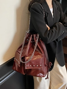 Waterproof burgundy bucket bag with silver studs and chain strap, large capacity style