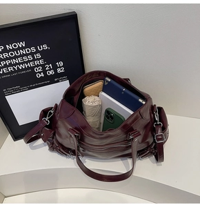 Detail view of burgundy tote bag interior showing large capacity for tablet and daily items