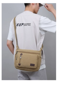 Men's khaki canvas messenger bag with adjustable strap and multiple zipper compartments