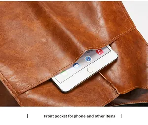 Detail view of the front pocket on a brown lychee pattern tote bag holding a tablet