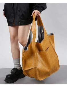Macro shot showing mustard yellow vintage tote bag texture and large exterior pocket
