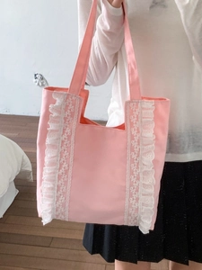 Pink canvas tote bag with white lace ruffle edges for elegant daily commuting style