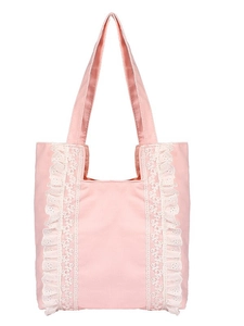 Minimalist pink canvas tote bag with white lace embroidery and ruffled shoulder straps