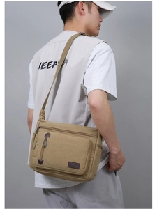 Men's vintage khaki canvas messenger bag with adjustable strap and multiple zip pockets