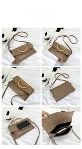 Detail views of brown crocodile embossed bag with gold handle and interior storage