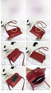 Detail of red crocodile pattern clutch bag showing gold D-handle and interior space