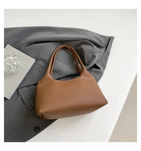 Brown rivet hollow-out shoulder bag featuring lychee textured faux leather with round arc handle