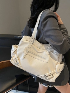 Chic beige PU leather tote bag with rivet details and adjustable strap for women