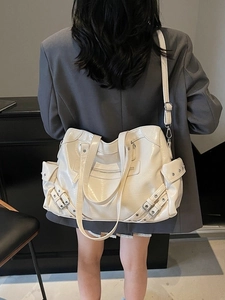 Off-white large capacity tote bag with silver rivets and punk style shoulder straps