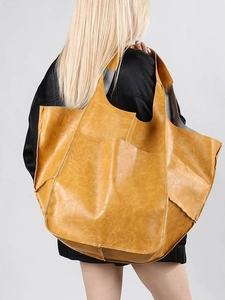 Minimalist large mustard yellow faux leather tote bag with front pocket for daily commute