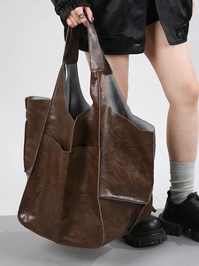 Vintage large capacity dark brown oil wax leather tote bag for women shown with model