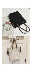 Detailed views of canvas tote bags with leather handles in black and cream white colors