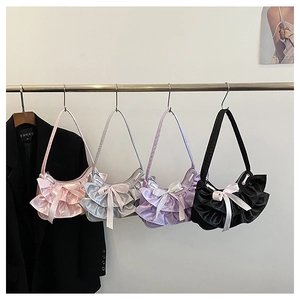 Selection of ruffled satin shoulder bags with bows in pink, silver, purple, and black colors